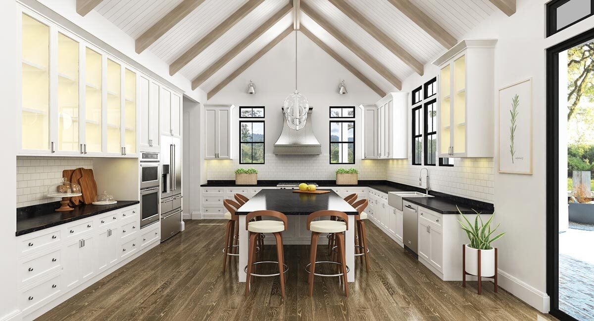 The kitchen is equipped with stainless steel appliances, white cabinetry, black countertops, and a large center island.The kitchen is equipped with stainless steel appliances, white cabinetry, black countertops, and a large center island.