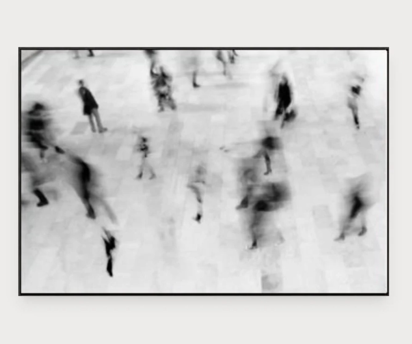 A piece of grey and white abstract wall art depicting a time lapse at Grand Central Station