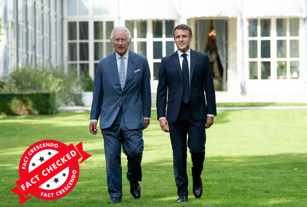Two men in suits walking on grass

Description automatically generated