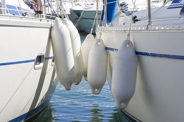  A boat docked with properly placed fenders.