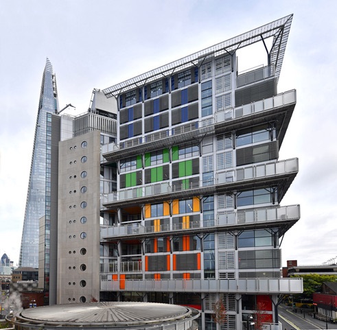 This hospital building, a noteworthy point in any architectural guide, showcases a unique geometric design with colorful panels.