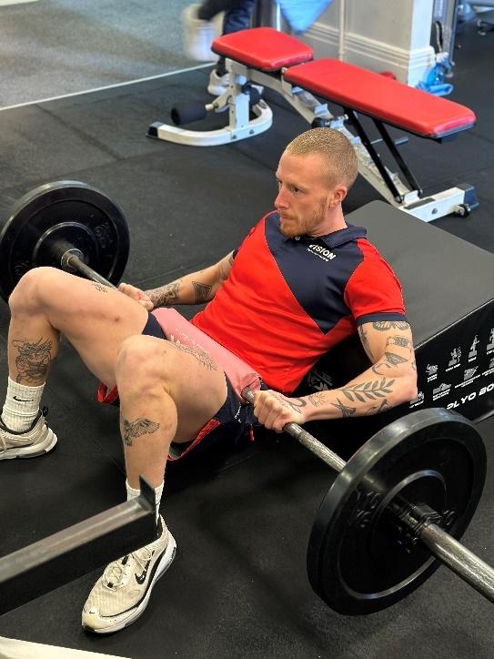 a Vision PT personal trainer performing the hip thrusts exercise setup