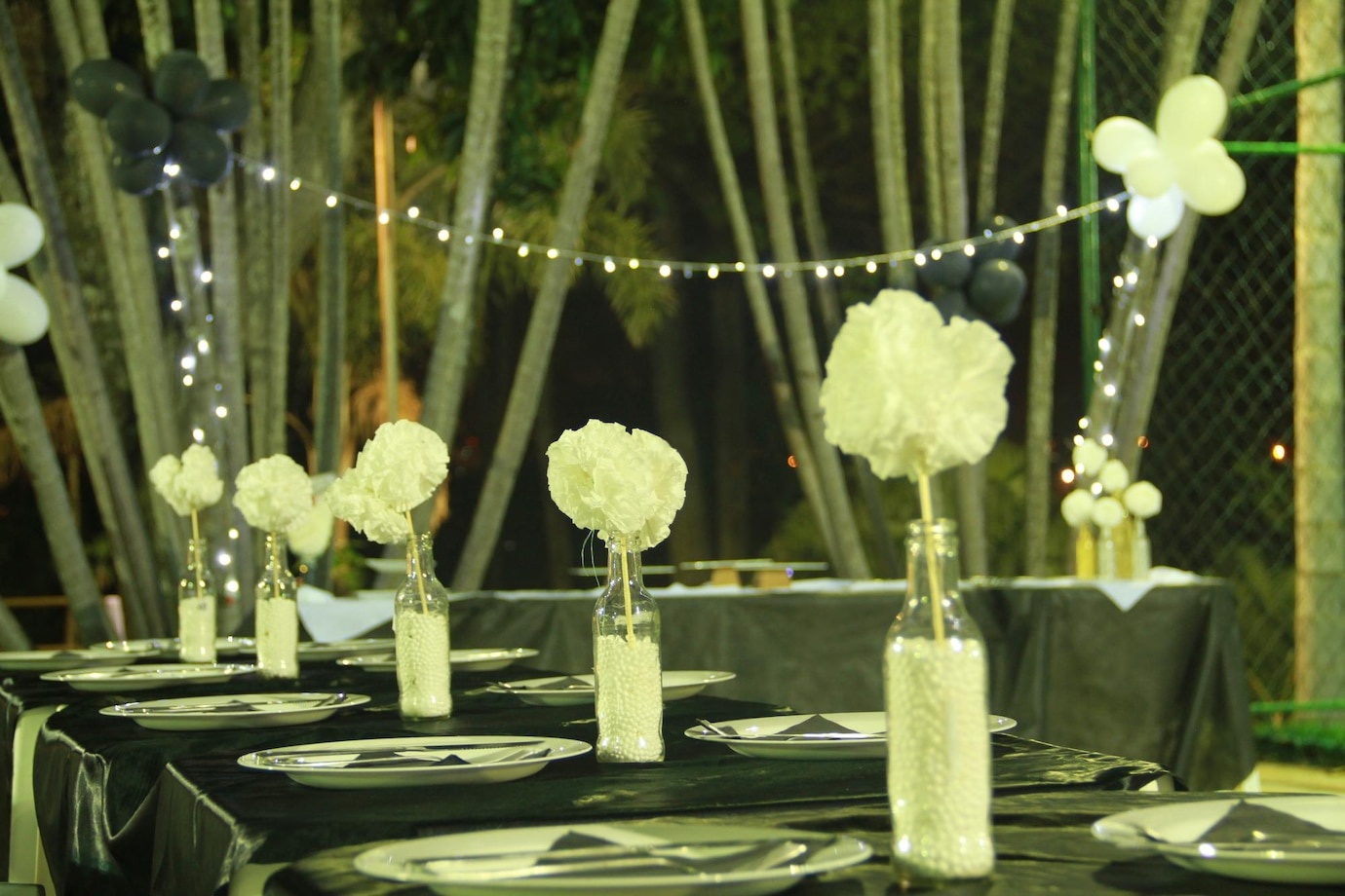 Beautiful reception tables styled with table olive green wedding decor, featuring olive linen runners, olive branch centerpieces, gold cutlery, and greenery wedding table settings for a sophisticated, earthy celebration.
