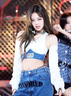 This Contains an Image of Jennie – BlackPink wearing a Blue “Censored” Denim Jeans 