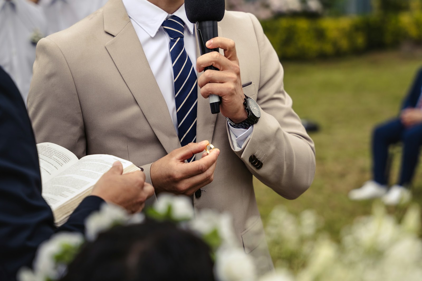 A man giving a speech at a wedding