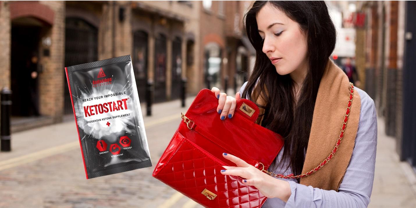 A person holding a red purse

Description automatically generated