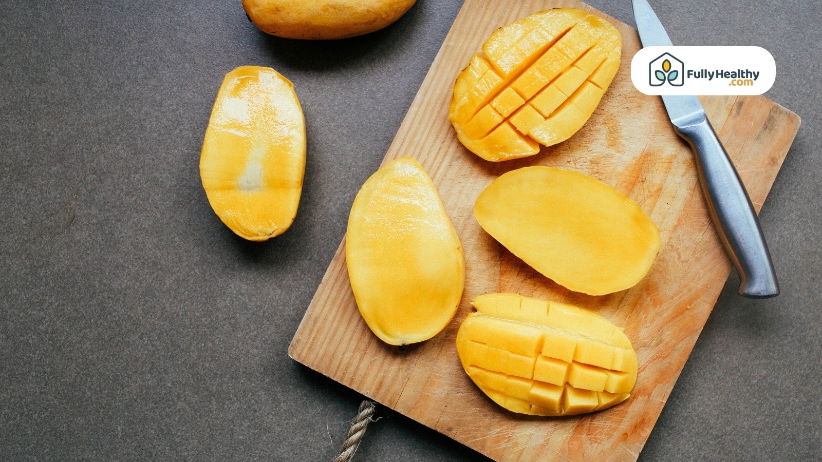 Close-up of ripe yellow mangoes stacked together at market stall