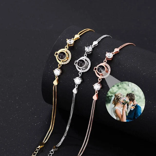 Personalized Photo Projection Bracelet – See Your Memory Inside Collection of three delicate custom projection bracelets in gold, silver, and rose gold, each containing a hidden photo that can be revealed by shining a light through its central lens. A small circular inset demonstrates a projected image of a couple, emphasizing the personal and sentimental value of this unique keepsake.