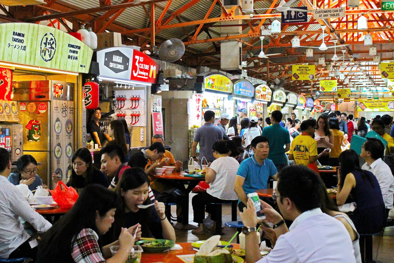 A group of people eating at a food court

AI-generated content may be incorrect.