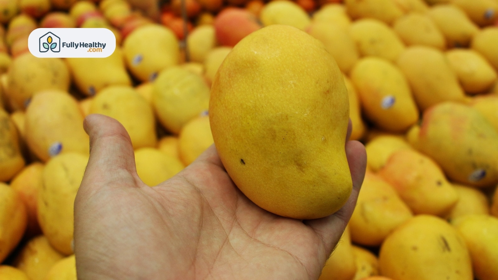 Juicy diced mango half with vibrant orange flesh on plate