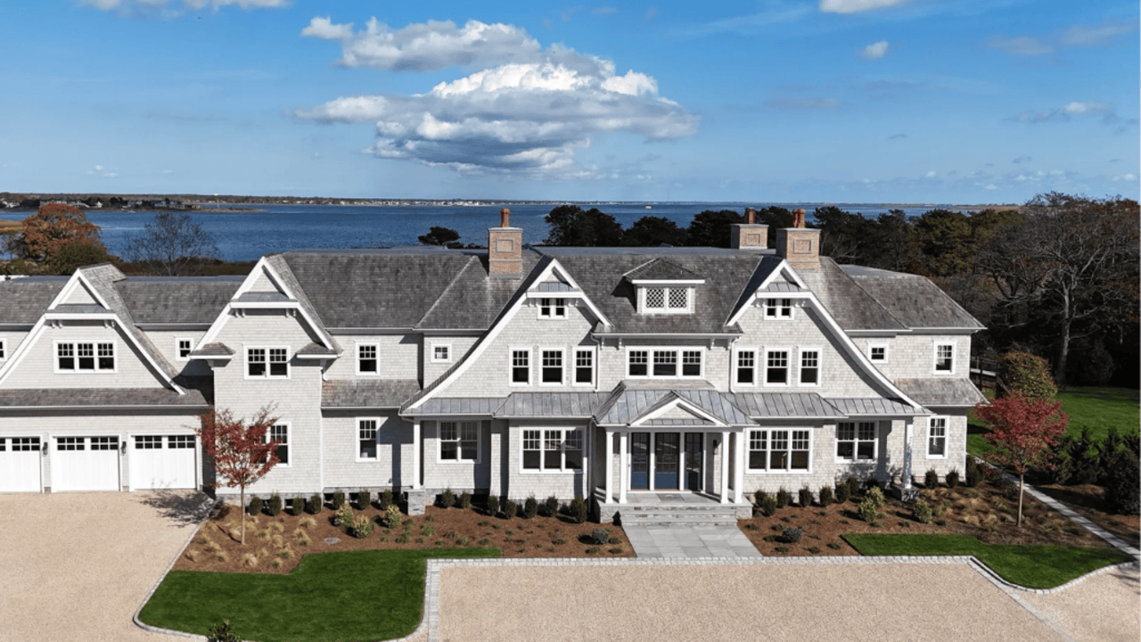 Tour This 8,094 Sq Ft Shingle-Style Waterfront Estate in Quogue, NY with Floating Staircase and 300-Bottle Wine Cellar