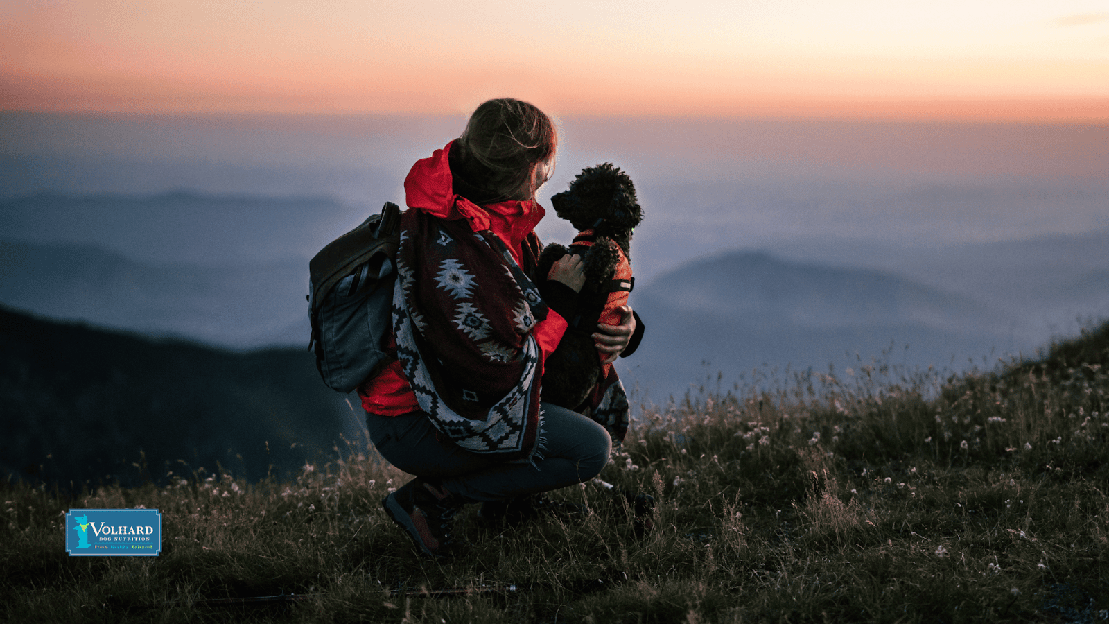 woman hiking with dog