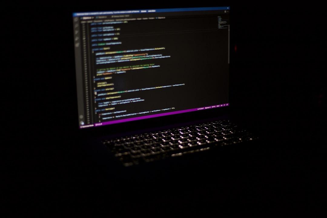 A lit laptop in a dark setting, symbolizing the competitive edge of AI integration in technology.