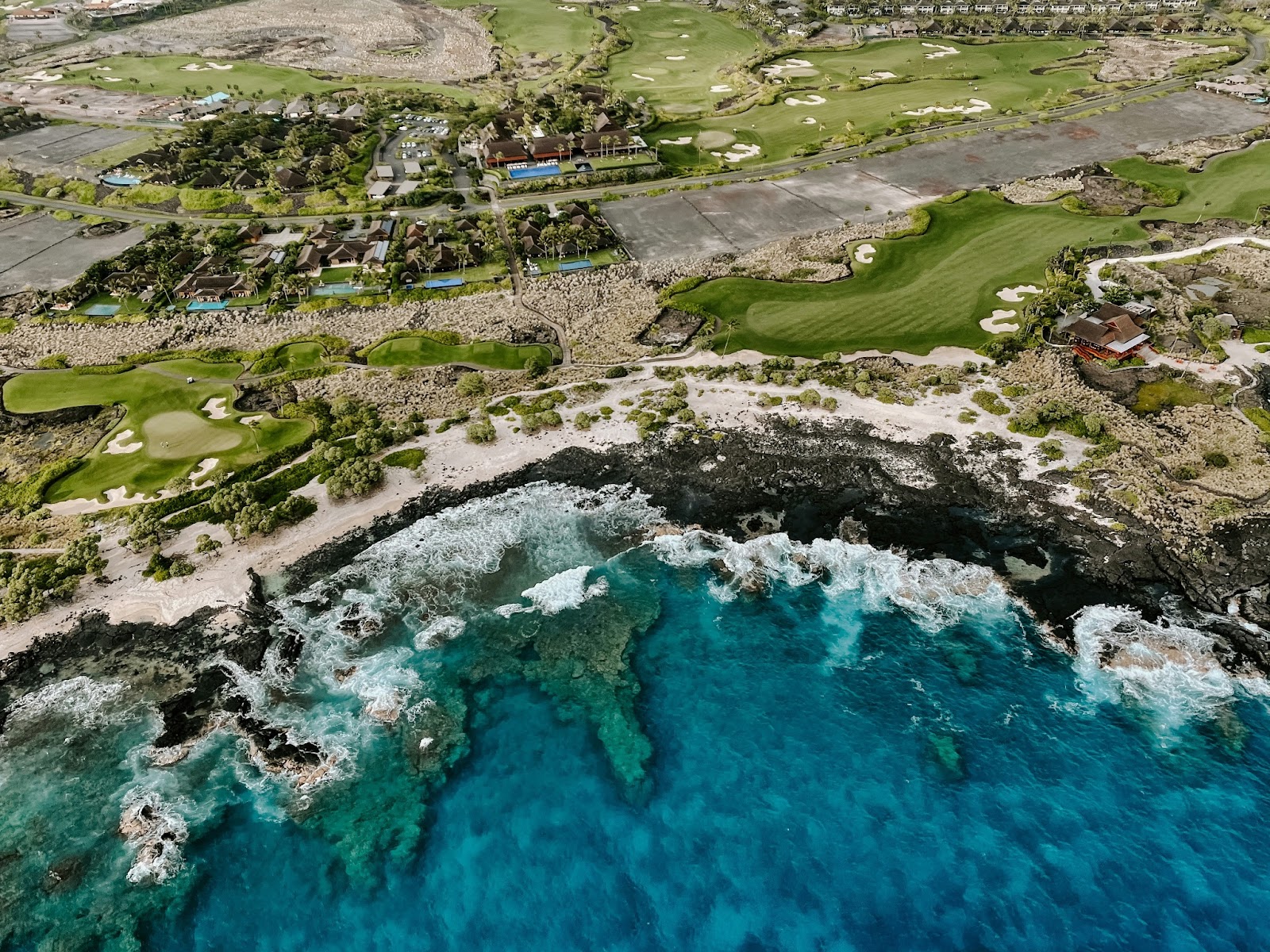 An Ariel view of the Kona Coast, known for its year-round sunshine, pristine beaches, and vibrant marine life.