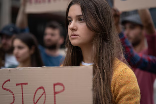 (woman protesting against civil rights violations)