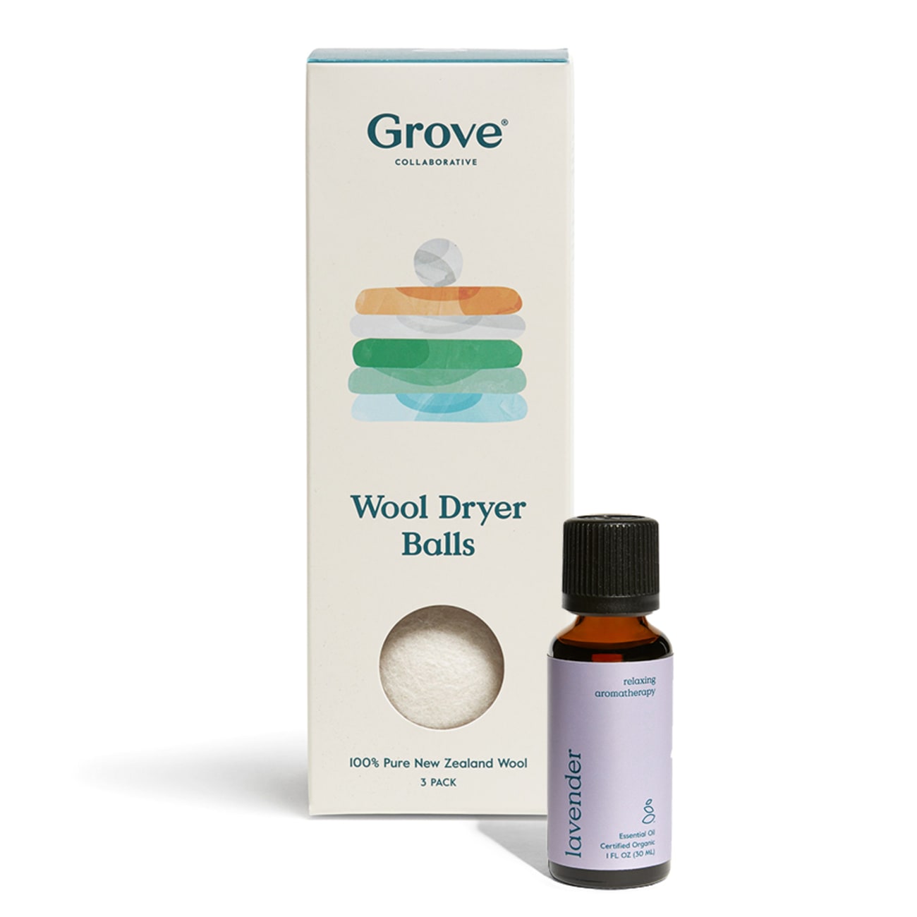 Wool dryer balls with a bottle of organic lavender essential oil, offering a sustainable, chemical-free alternative for softening clothes.