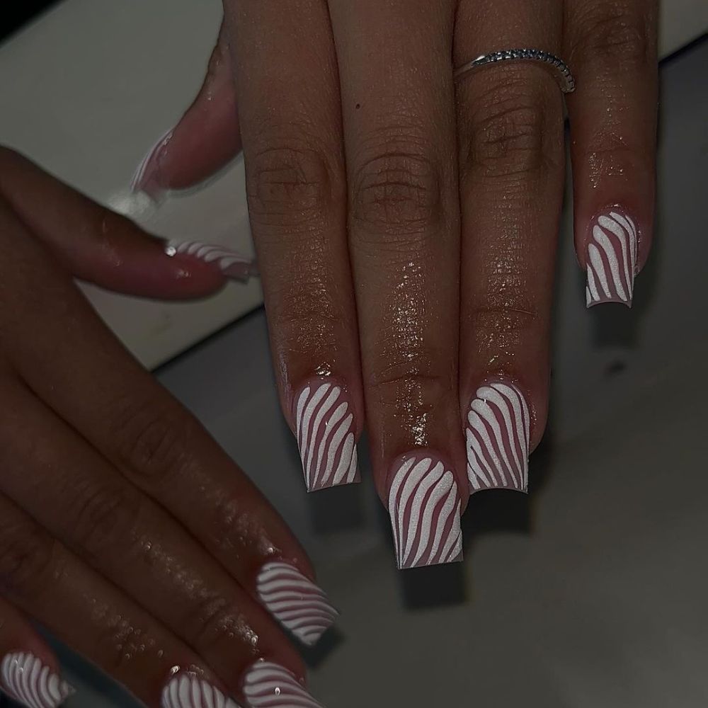 Simple White Nail Design having white swirls