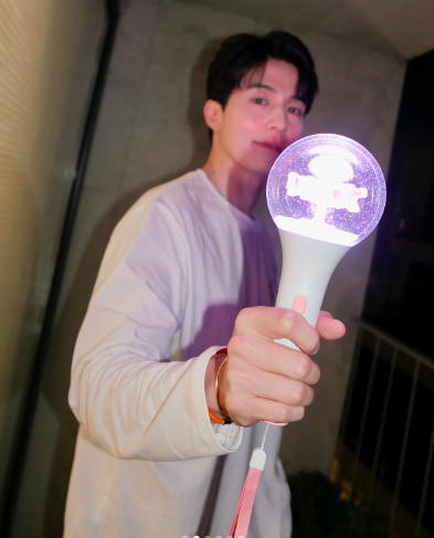 This  contain of image of Lee Dong holding Wook's light