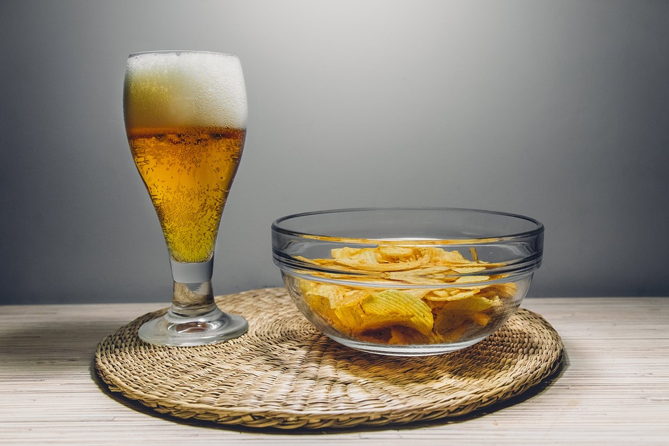 A pair of beer glass and chips at Little Miami to enjoy seasonal brews 