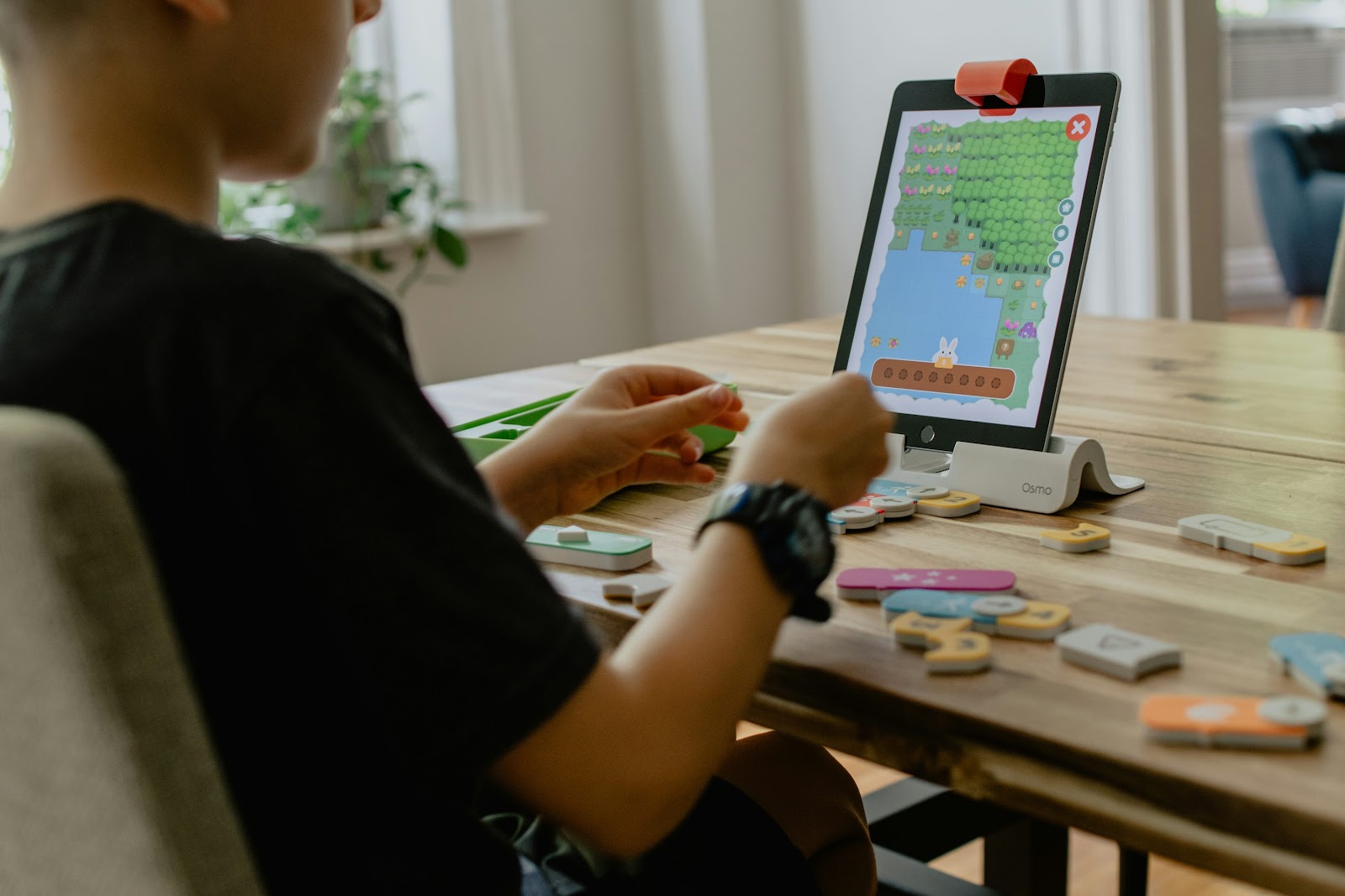 Boy practicing coding with an iPad app