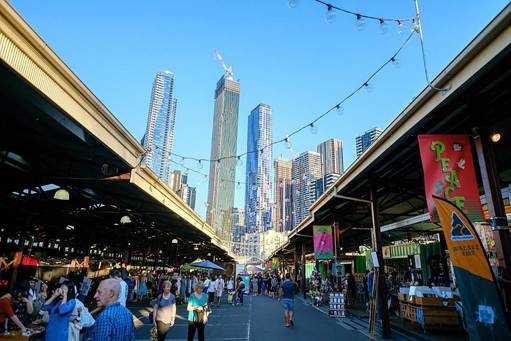 A street with people walking and walking in the city

AI-generated content may be incorrect.