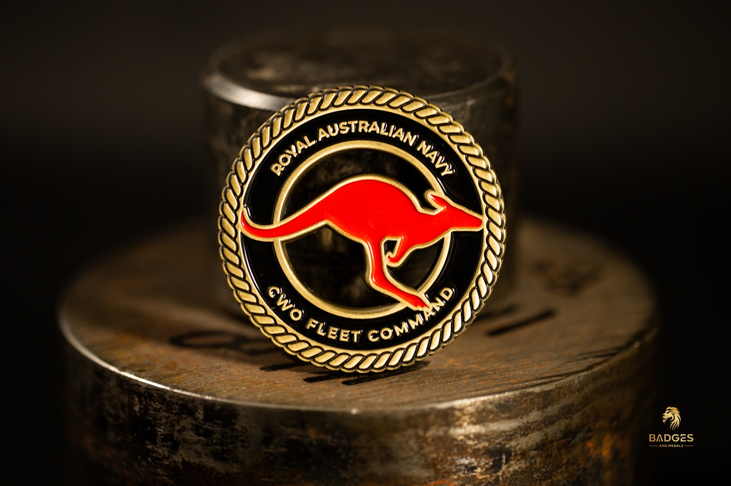 A Royal Australian Navy challenge coin with a cutout.