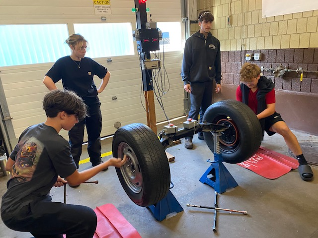 image of students visiting Old Colony's automotive department