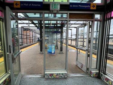 Current platform approach from the stairs and elevator, with many panes of glass blocking views." "Proposed platform approach with a full canopy and windscreen on the outside of the light rail tracks, with open sightlines down the platform.