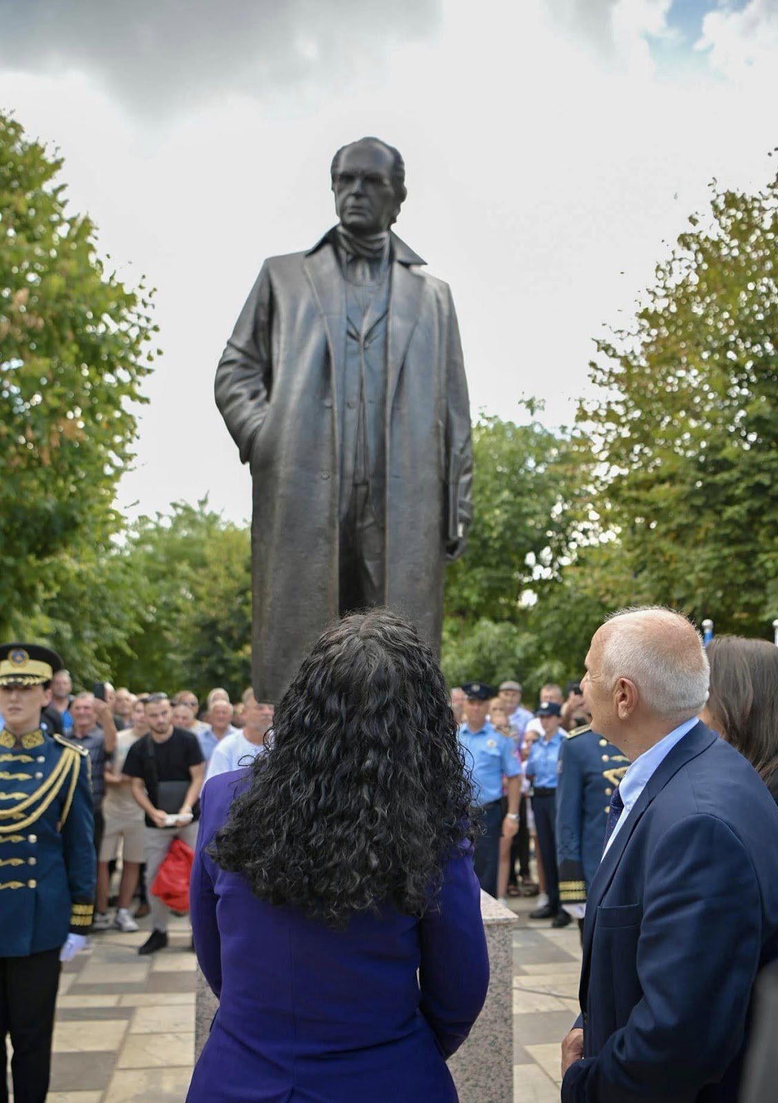 May be an image of 7 people and monument