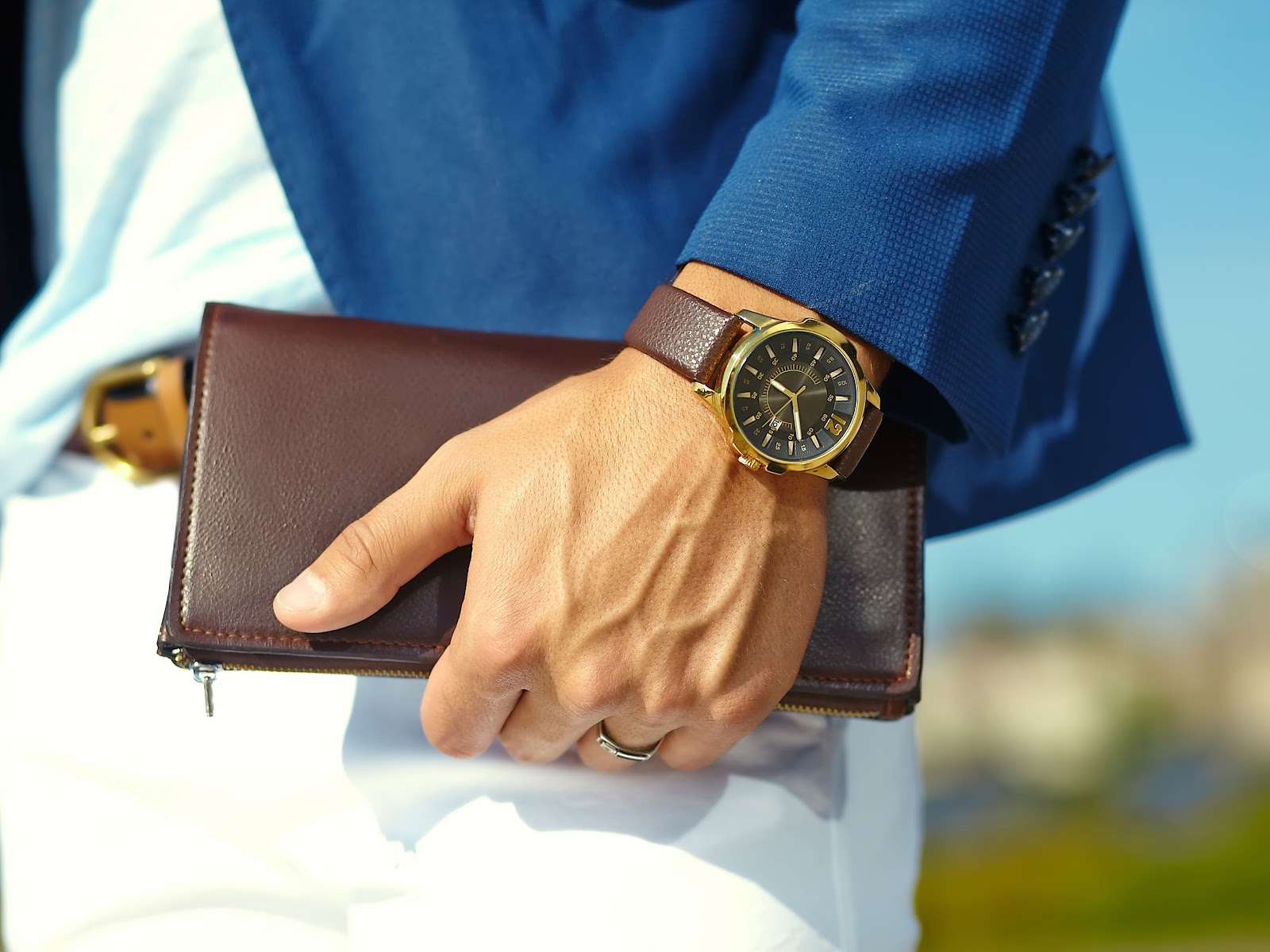 Man wearing an affordable formal watch showing durability