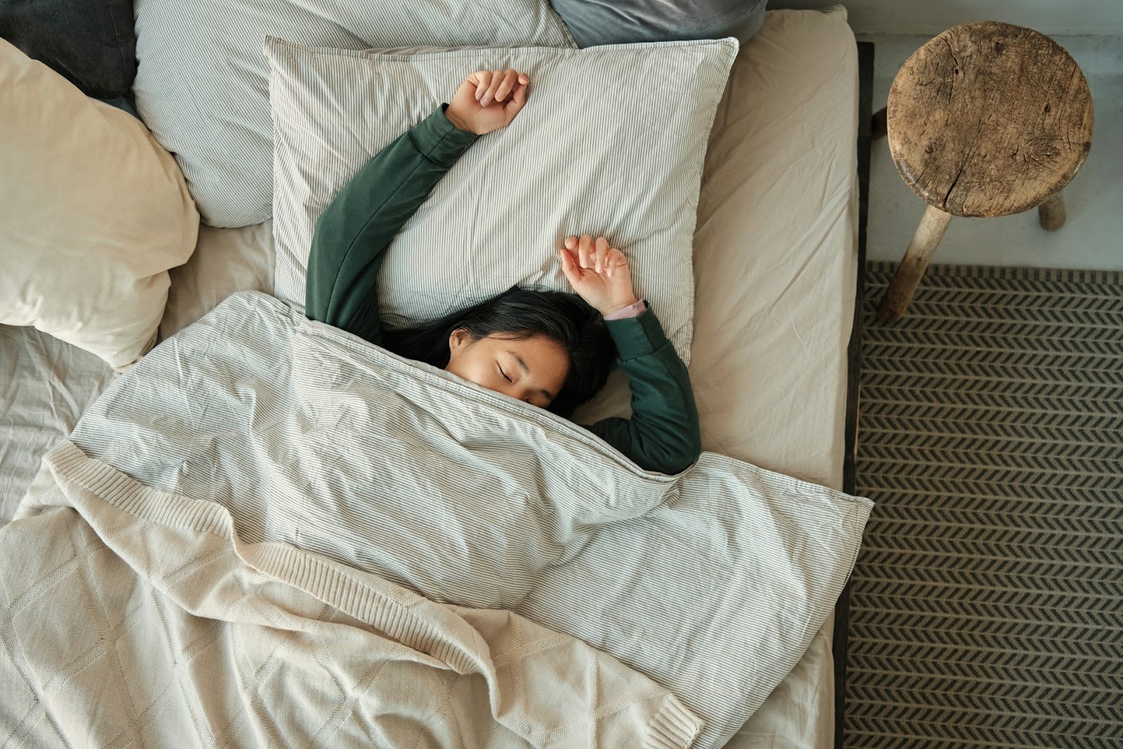 A woman fast sleep in her duvet