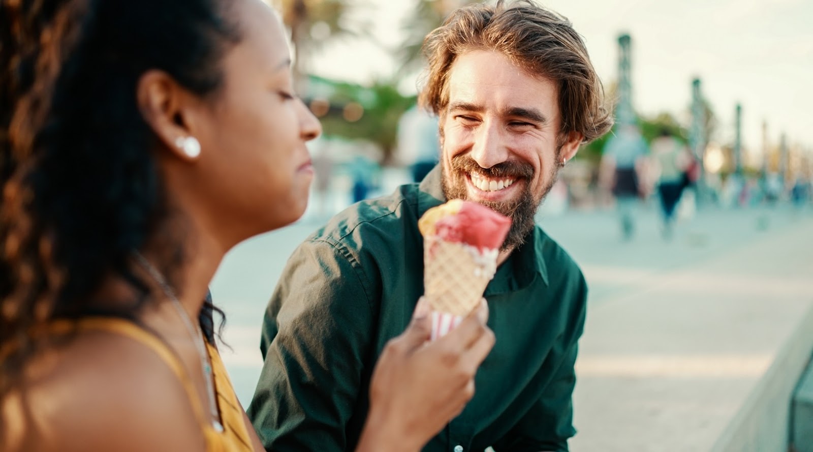 Close-up portrait of a happy interracial couple eating ice cream in Toronto, Markham.