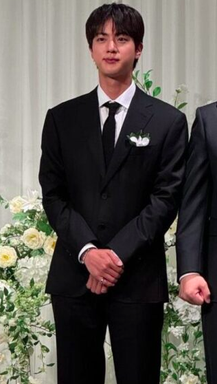 This contains an image of Jin on wedding 