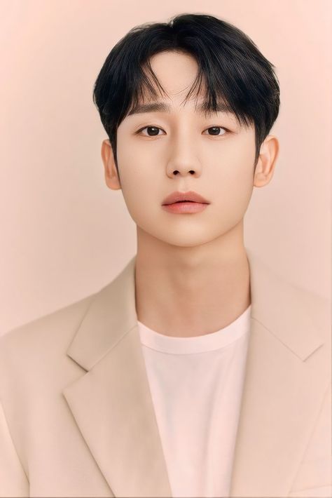 A photo of Jung Hae In on a brown suit and a vest inside of it 