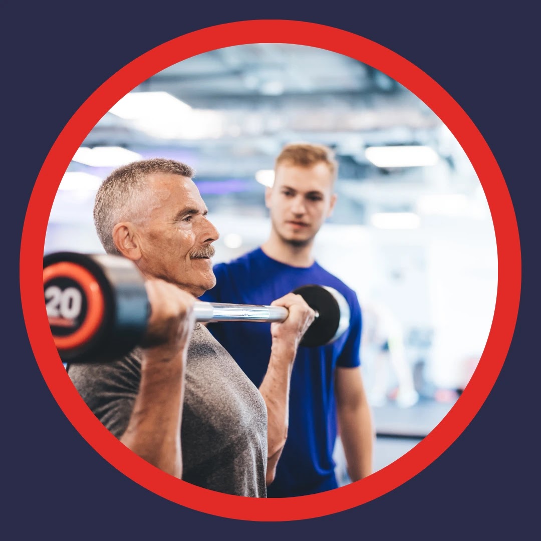 An older man lifts weights with a trainer. 