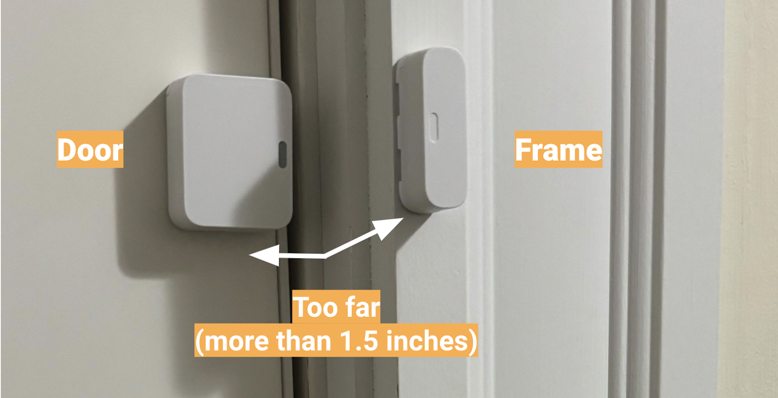 An Entry Sensor installed on a door, with a gap larger than 1.5 inches between both parts of the sensor.