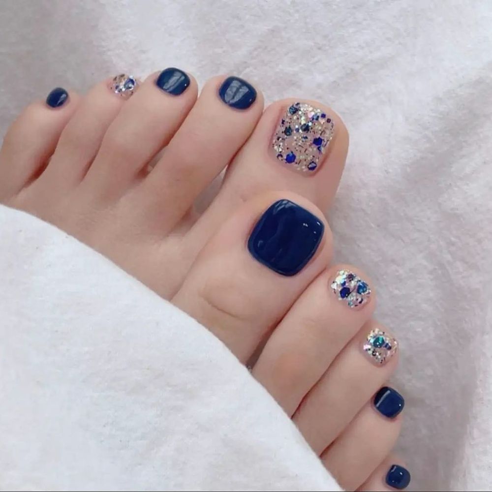 Close up of foot with radiant toe nail having Blue Nail Polish on Toes