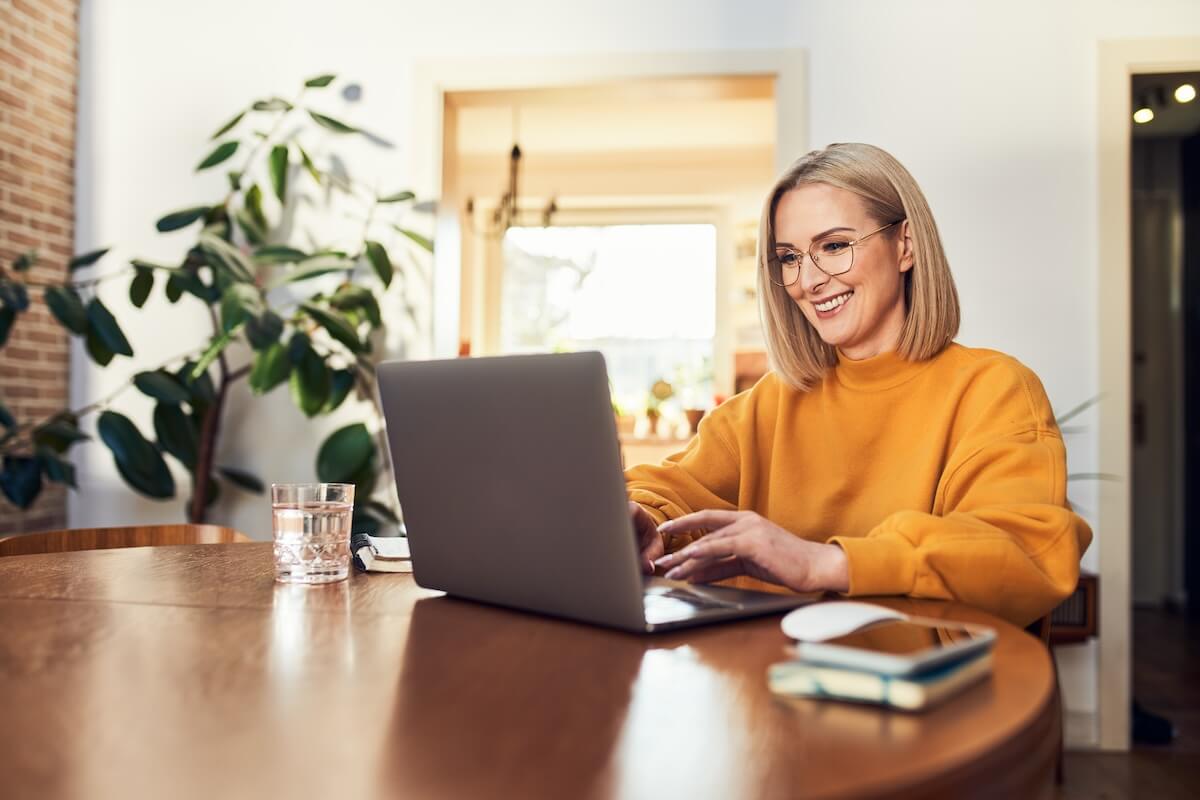 Woman using a laptop at home