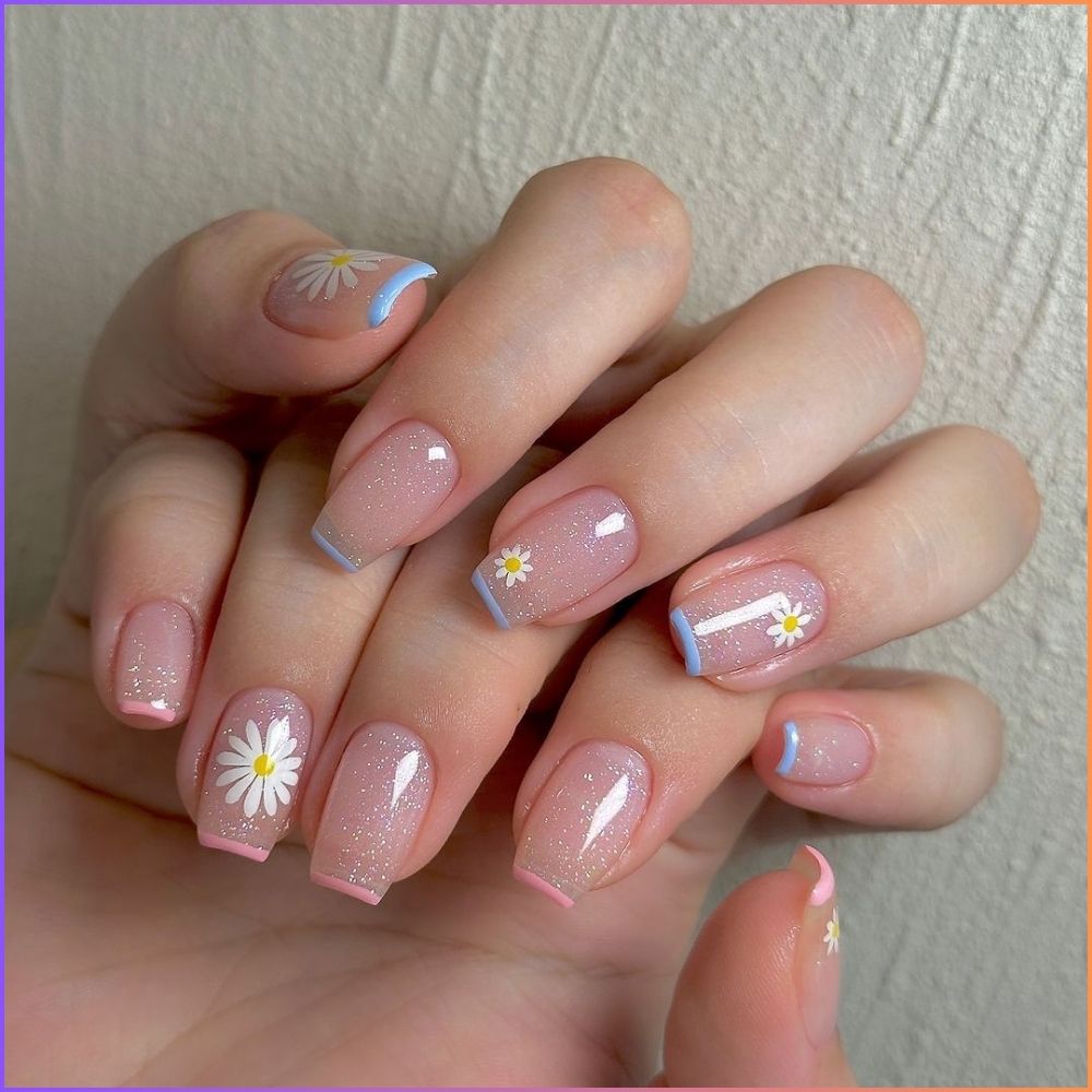 Close up of flowered short nail design with Pastel Nail Art with Daisies