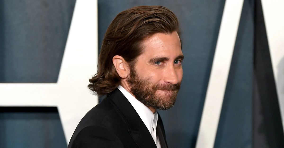 Jake Gyllenhaal discusses his 'nightmare' experience with the paparazzi, showcasing his Long Slick Back hairstyle.