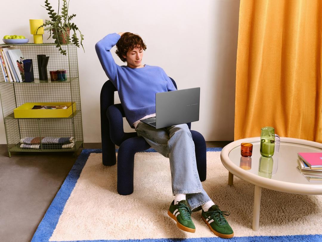 A person sitting in a chair with a computer

AI-generated content may be incorrect.