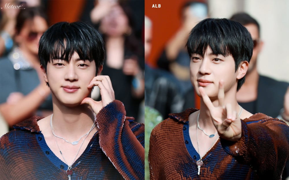 BTS Jin arriving at Milan Fashion Week in a Gucci leather outfit