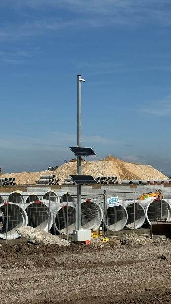 A group of pipes in a construction site

Description automatically generated