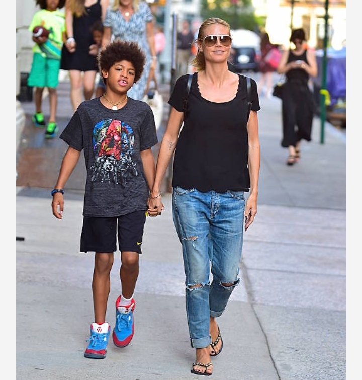 a younger Henry Günther Ademola Dashtu Samuel walking with his mother