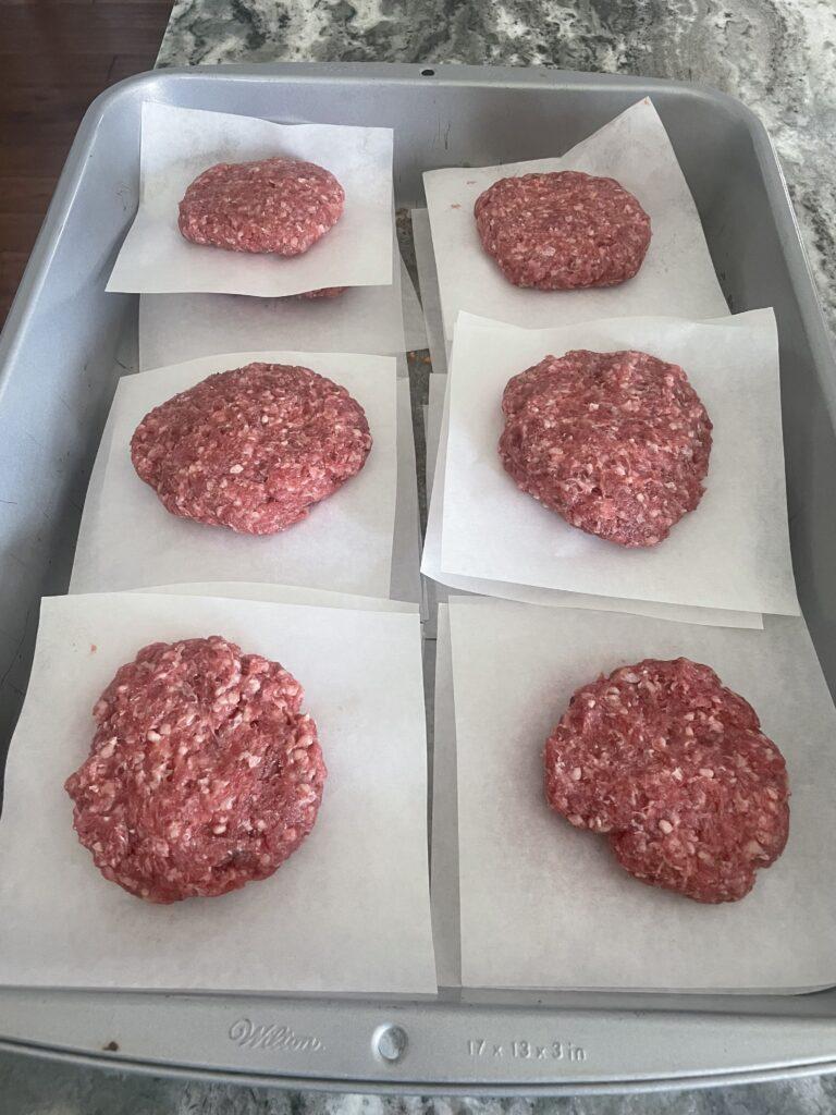 Burger patties on a tray