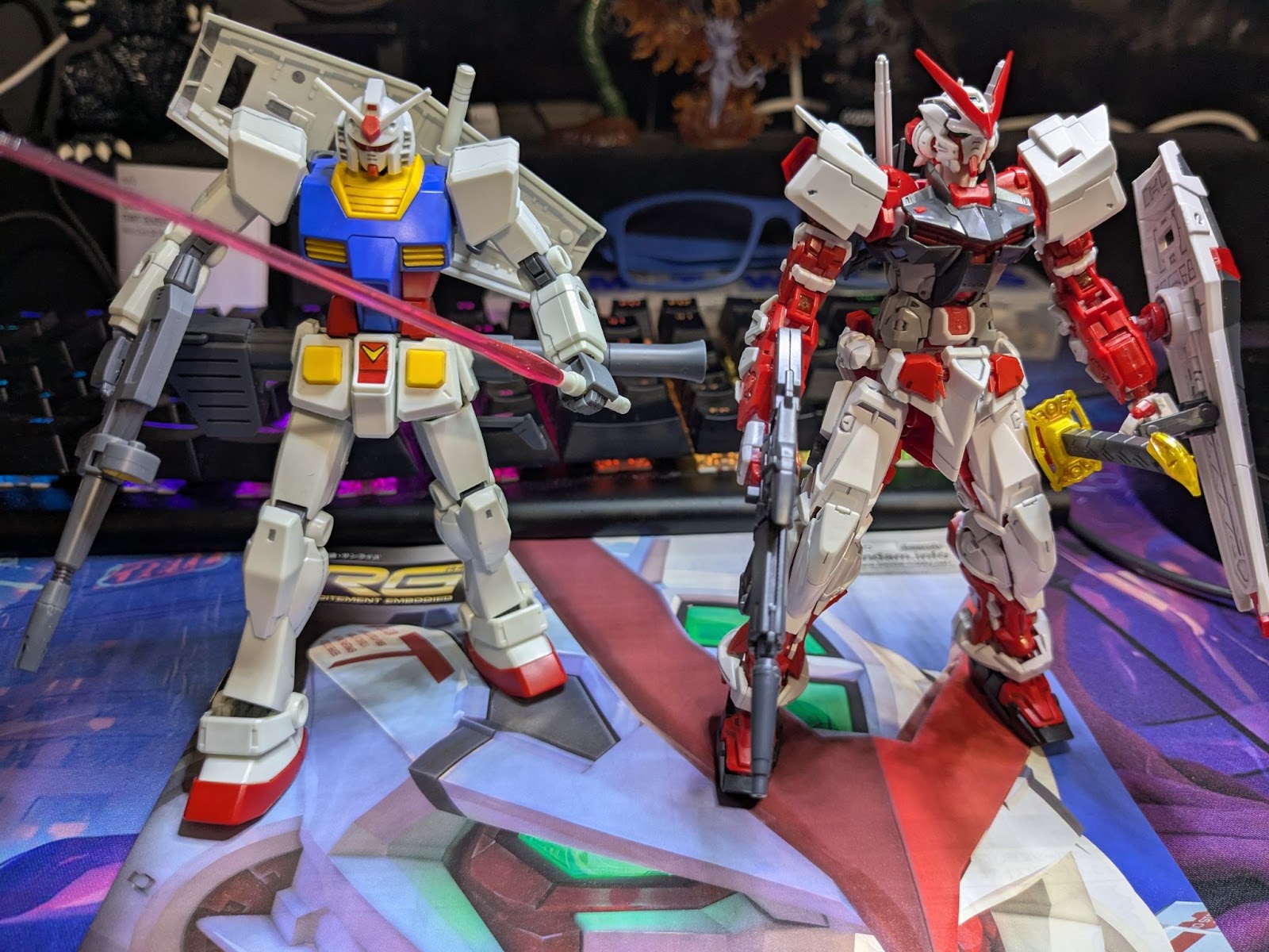 A photo of Mark's first two gunplas: an HG RX-78-2 and a RG Astray Red Frame