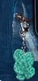 This contains an image of  clover keychain