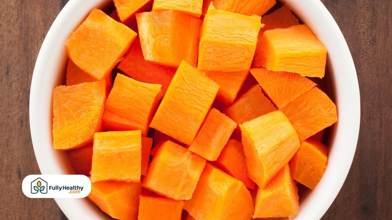 Bowl filled with fresh cubed carrots pieces