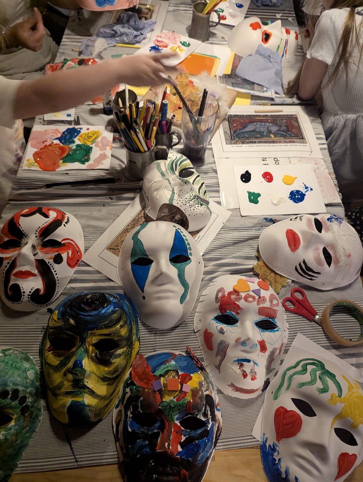Children painting Caliban masks