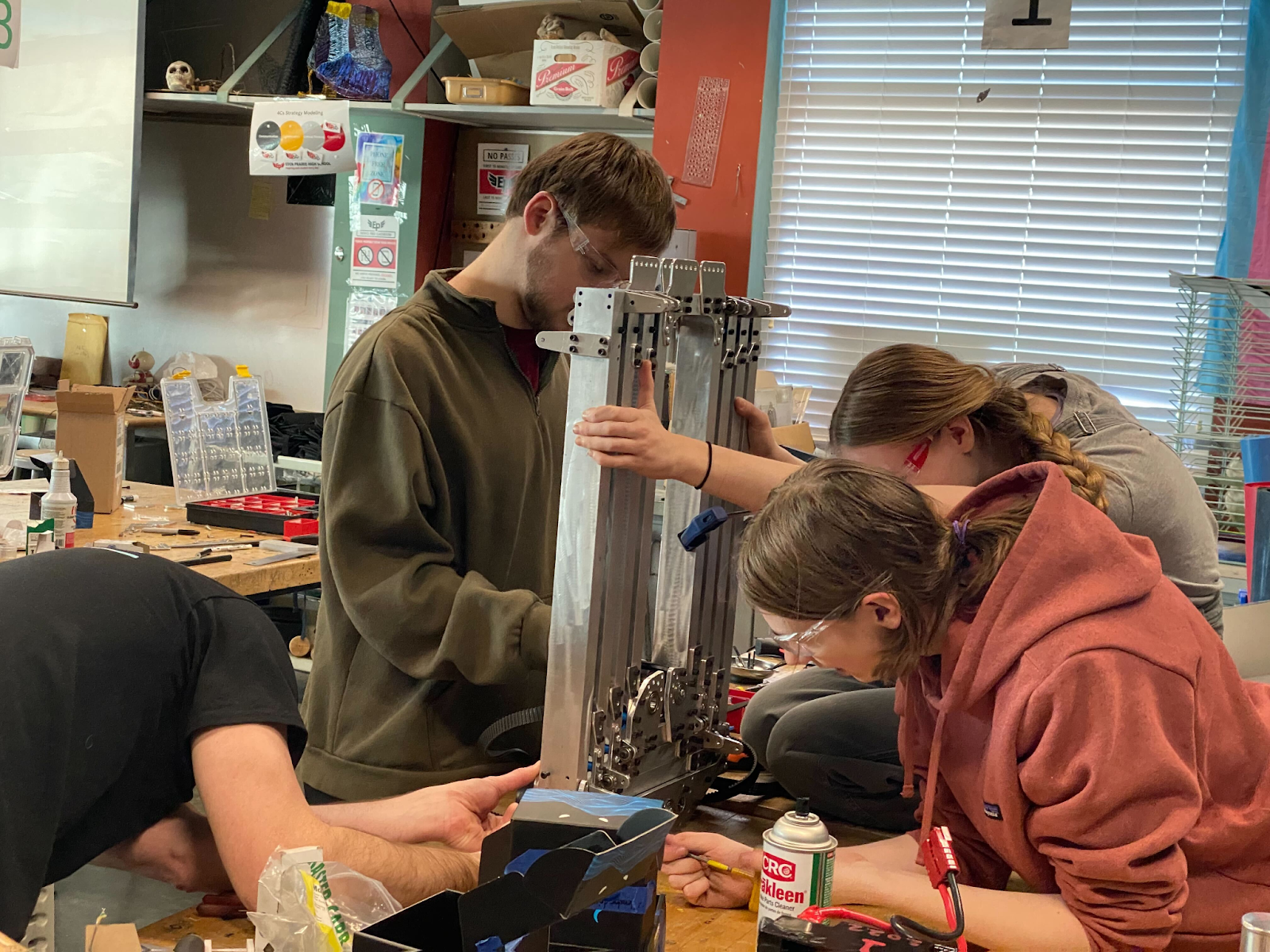 Three Talon team members working on the elevator construction